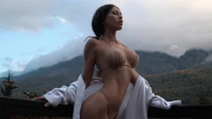 Professional OnlyFans model researching profitable niches and market trends on a laptop in a modern home office